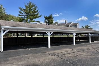 a covered parking lot with a building in the background at Deercross Apartments, Cincinnati, 45236
